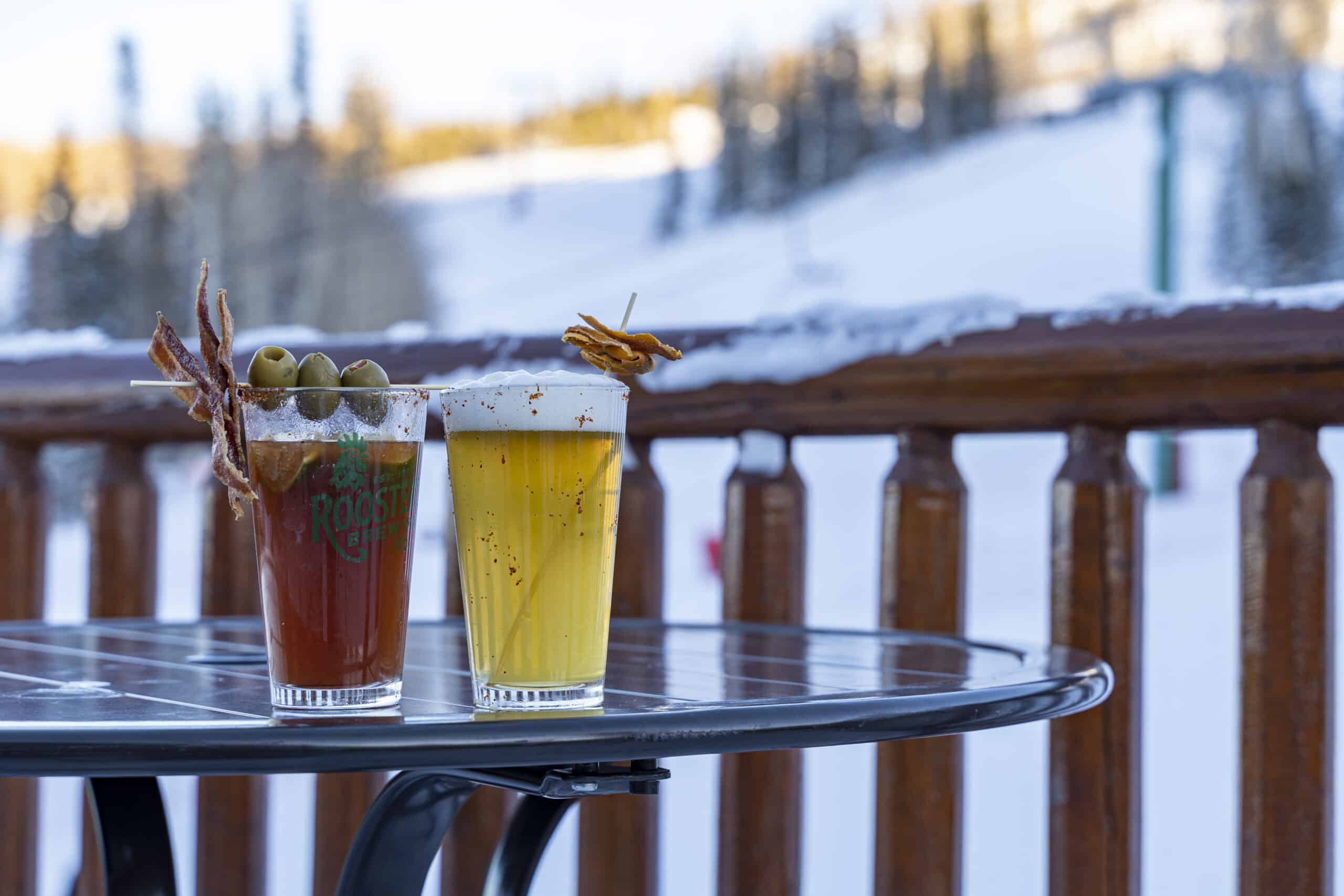 specialty beer cocktails on the snowy porch of Last Chair Grill & Brews