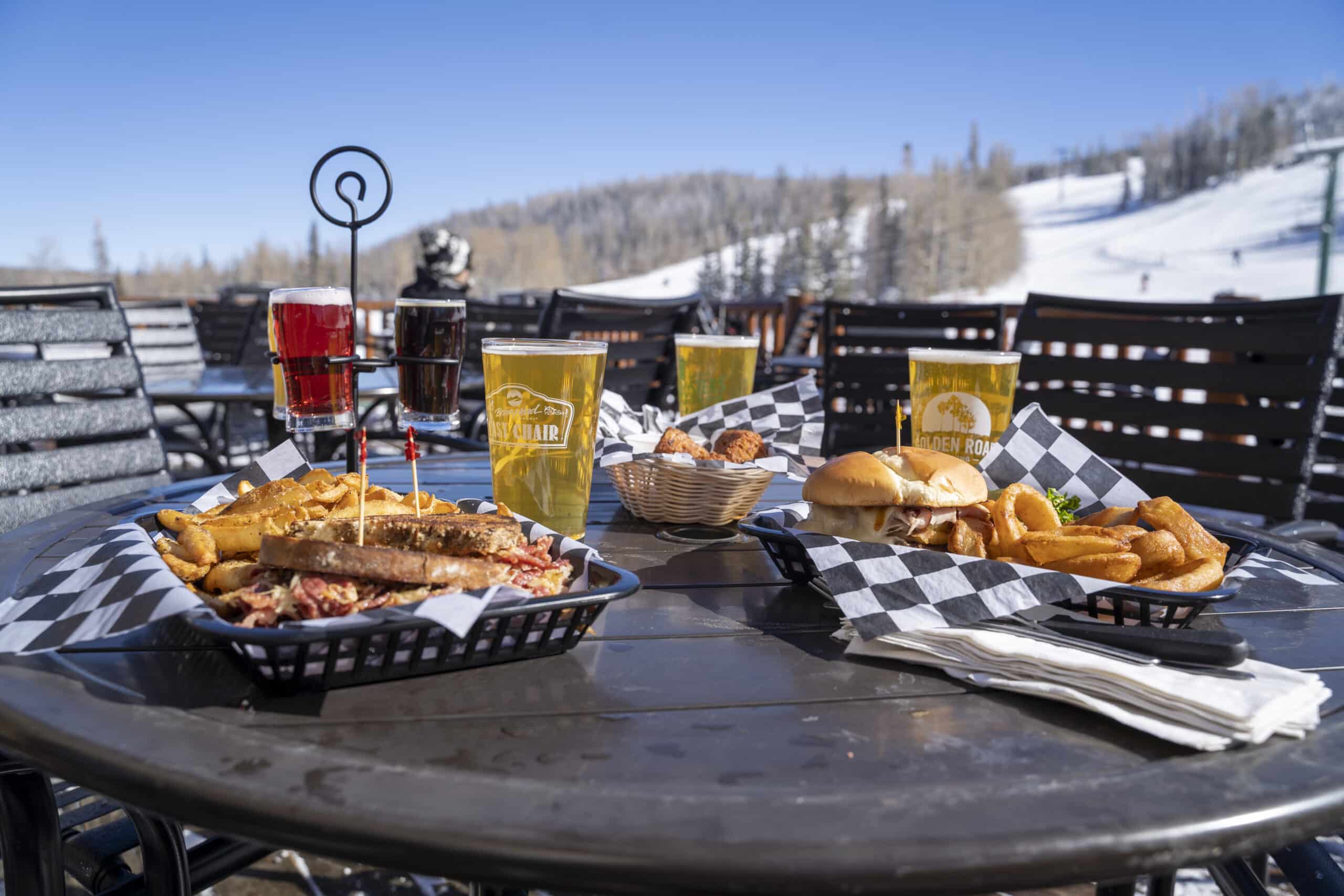 Food specials at Last Chair Grill and Brews outside on porch for Apres