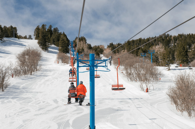 riders on chairlift at Sandia Peak Ski Area